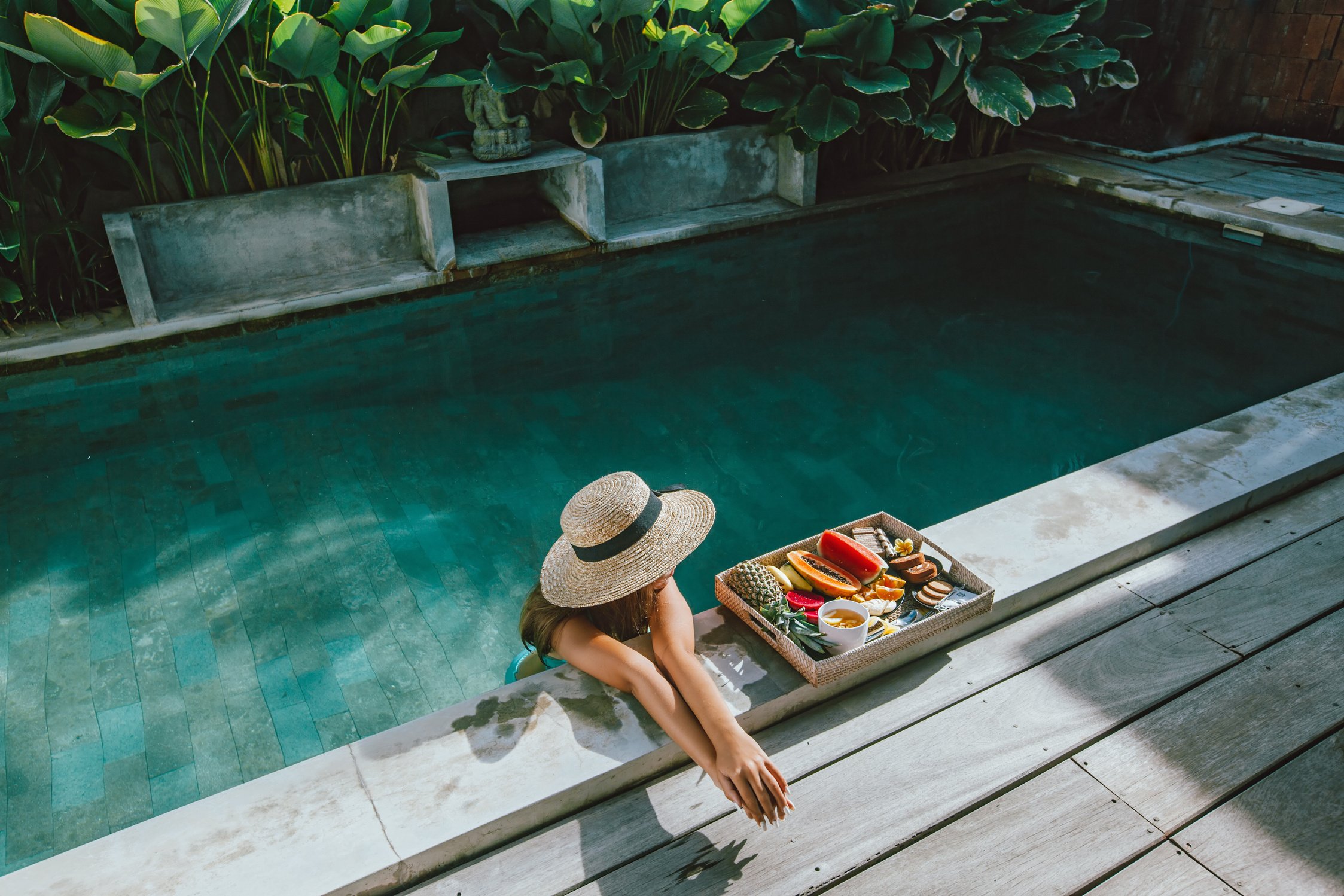 Woman in a Luxurious Villa with Fruit Breakfast 