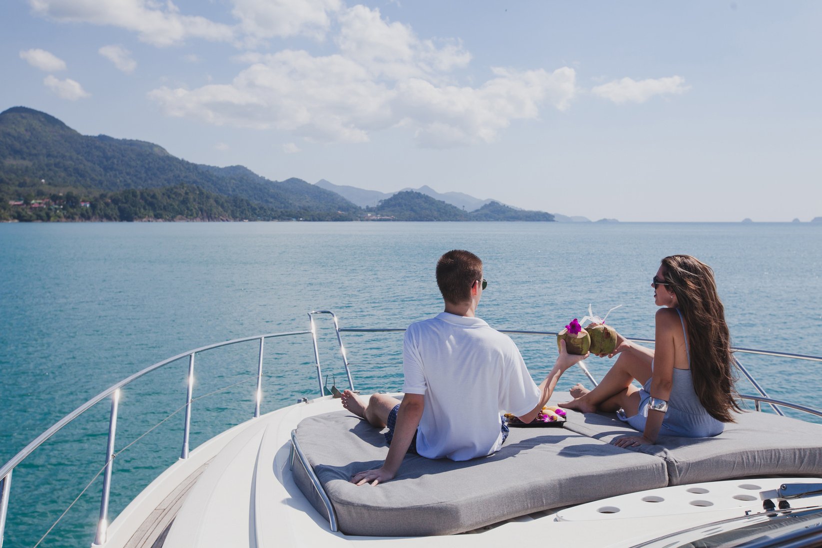 couple enjoying honeymoon onboard of luxury boat, luxurious yacht